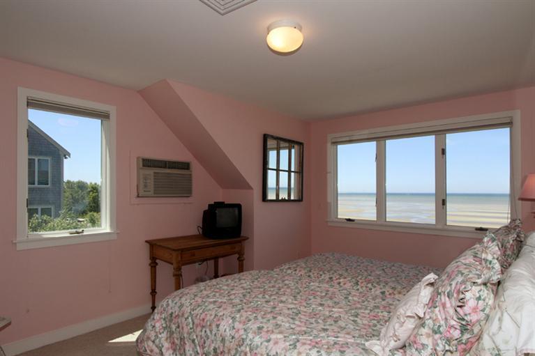 40 Bayshore Lane Eastham, MA 02642 - Photo 31 of 35 a bedroom with a bed and a window