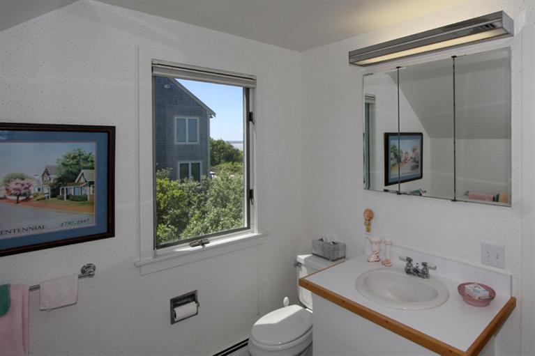 40 Bayshore Lane Eastham, MA 02642 - Photo 33 of 35 a bathroom with a sink mirror and toilet