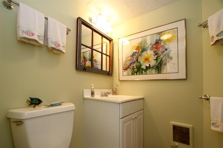 40 Bayshore Lane Eastham, MA 02642 - Photo 34 of 35 a bathroom with a sink mirror and toilet