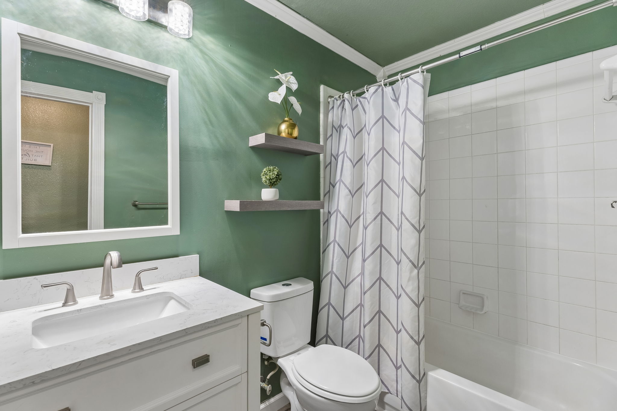 159 Invierno Street Kyle, TX 78640 - Photo 31 of 40 The updated secondary bath brings a more contemporary look.