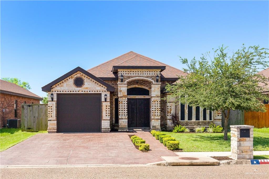 3017 Colorado Avenue McAllen, TX 78504 - Photo 1 of 1 a front view of a house with a yard and trees