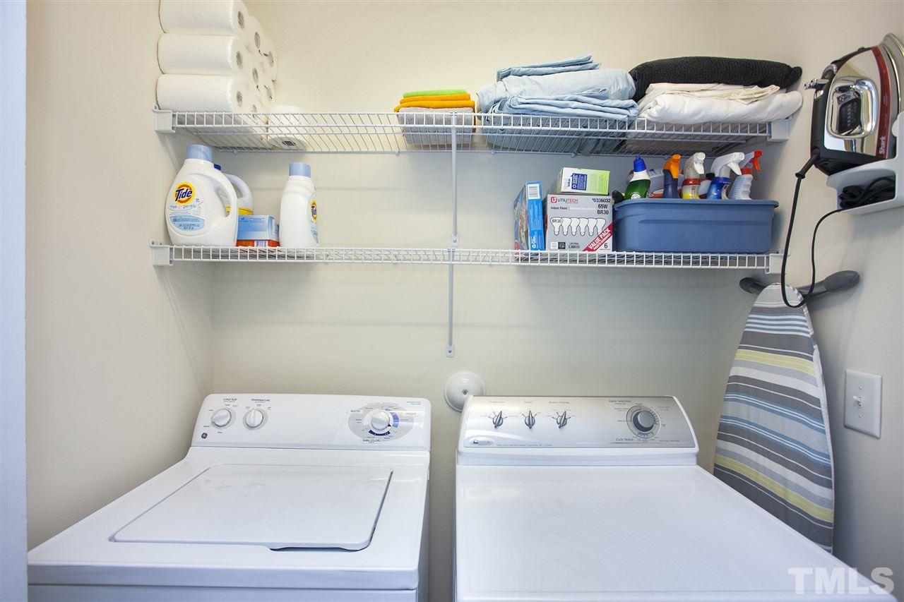 7725 Winners Edge Street Raleigh, NC 27617 - Photo 20 of 25 a utility room with dryer and washer