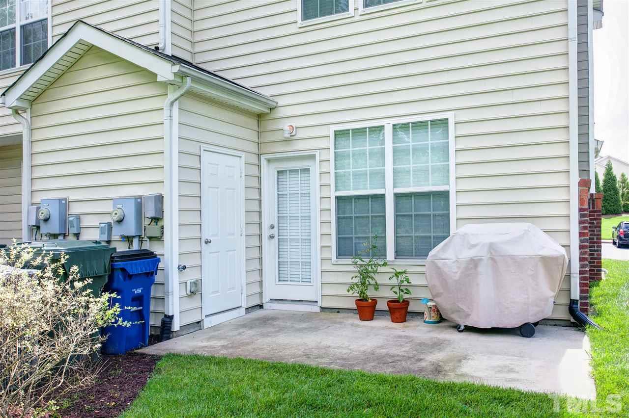 7725 Winners Edge Street Raleigh, NC 27617 - Photo 21 of 25 a view of a house with backyard sitting area and garden