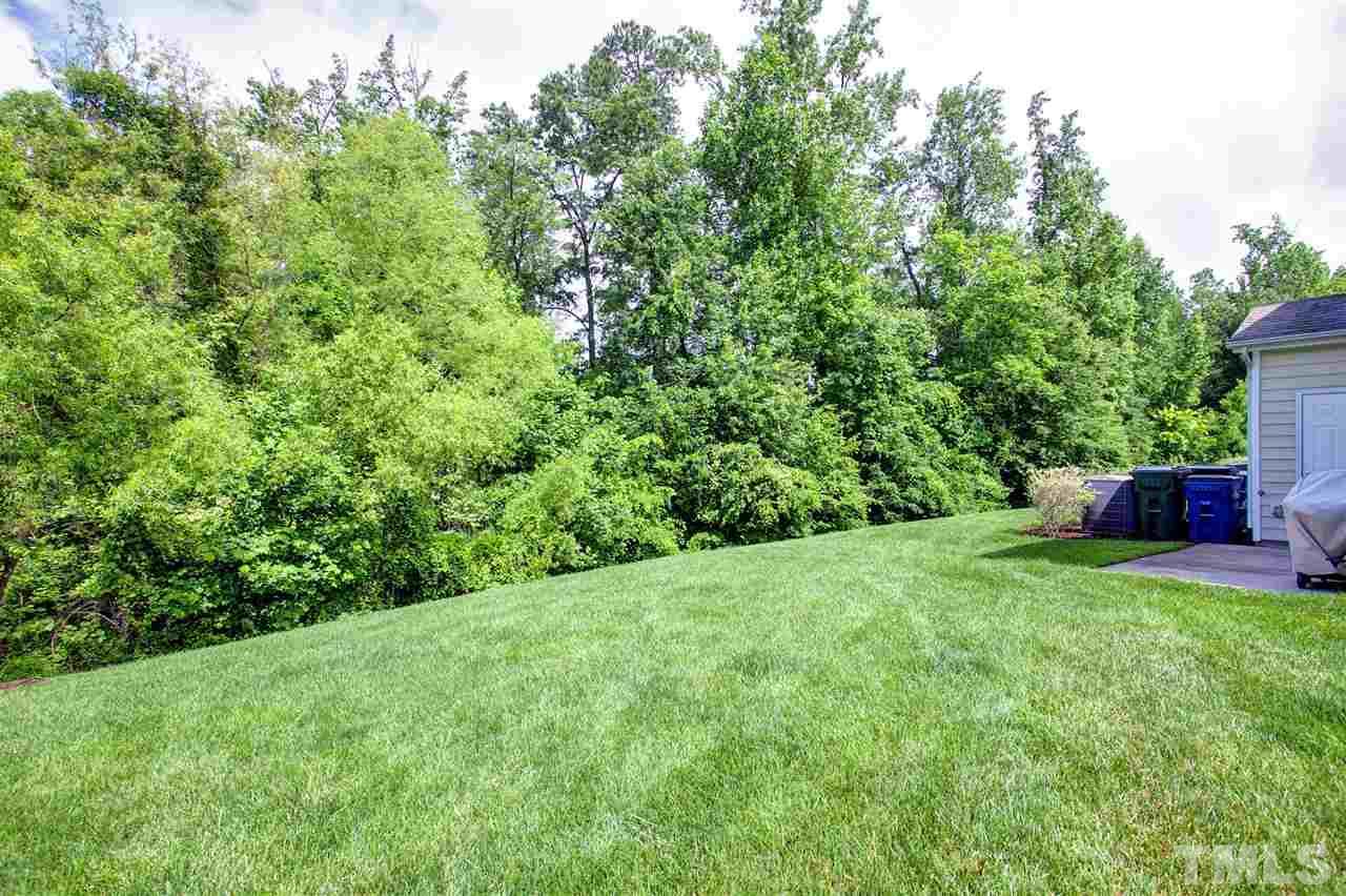 7725 Winners Edge Street Raleigh, NC 27617 - Photo 23 of 25 a view of a back yard