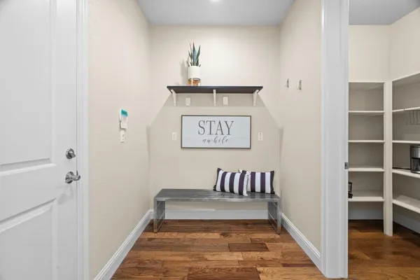 a spacious bedroom with a bed and ceiling fan