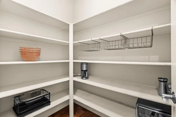 a spacious bathroom with a granite countertop sink mirror and bathtub