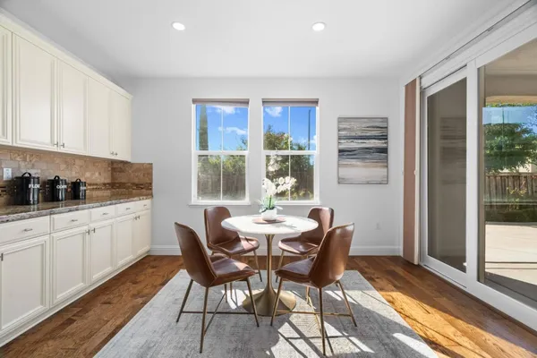a bathroom with a granite countertop shower mirror and a sink