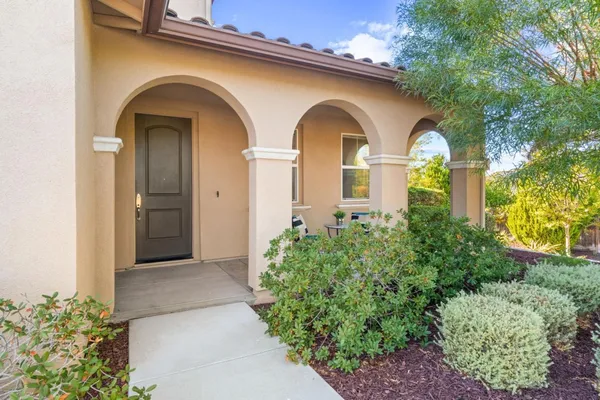 a view of a dining room with furniture and window