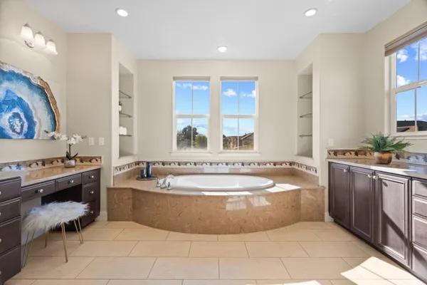 a view of a patio with table and chairs