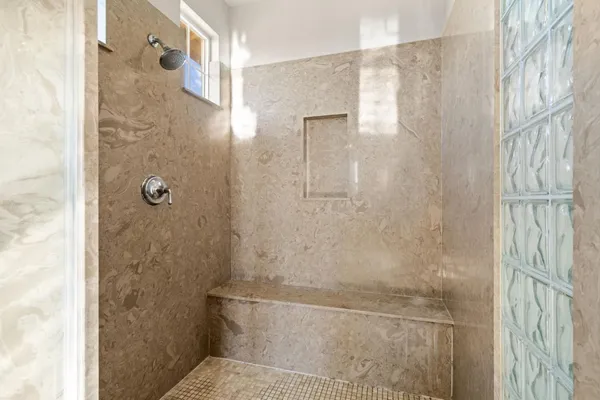 a front view of a house with yard garage and outdoor seating