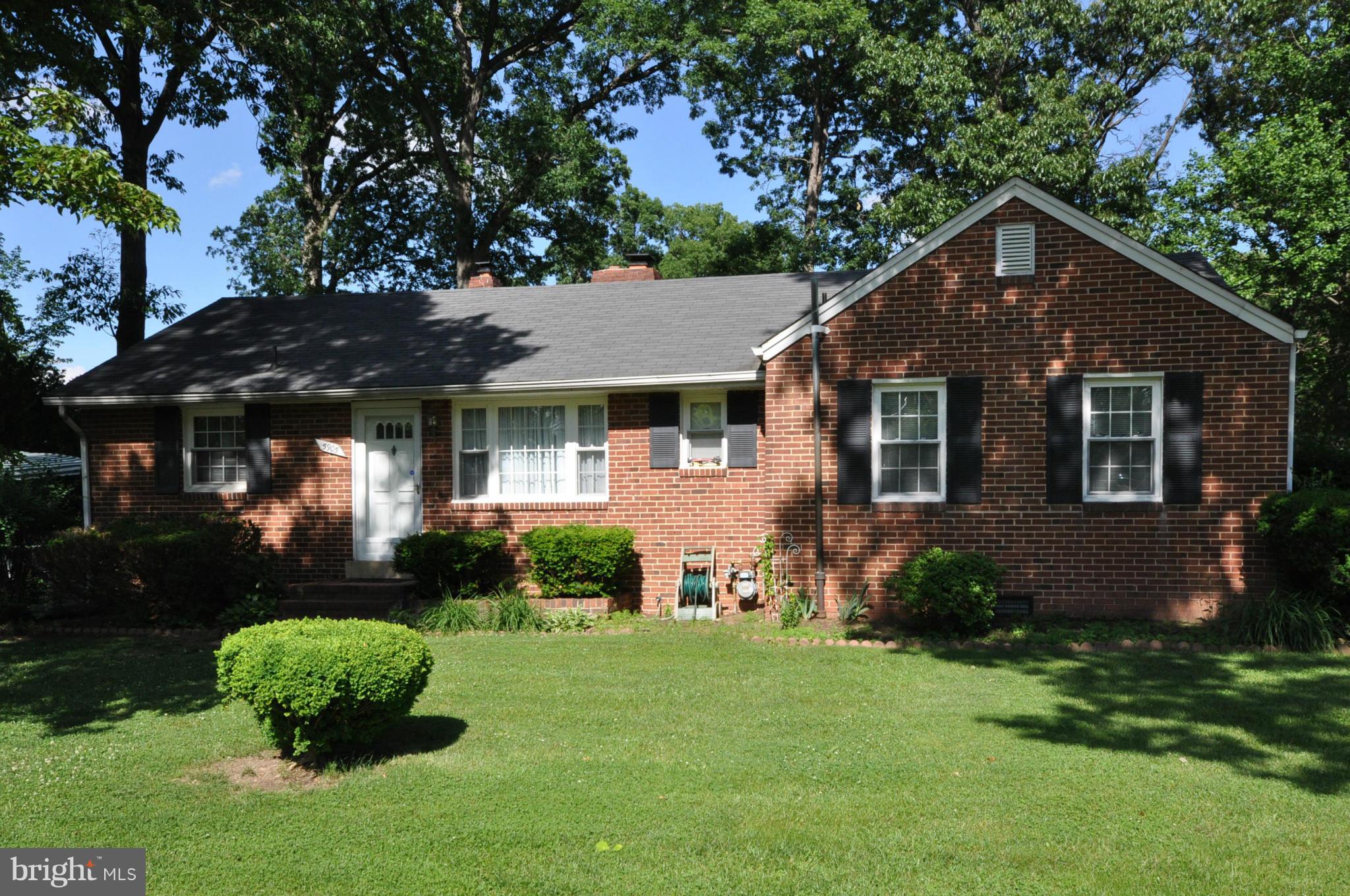 5905 Brookland Road Alexandria, VA 22310 - Photo 1 of 24 a front view of a house with a yard