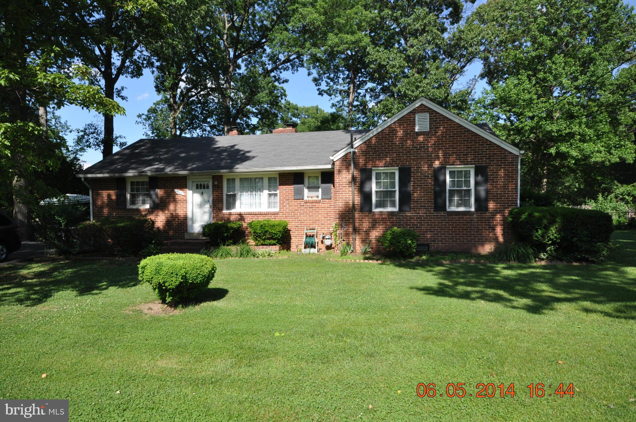 5905 Brookland Road Alexandria, VA 22310 - Photo 2 of 24 a front view of a house with a yard