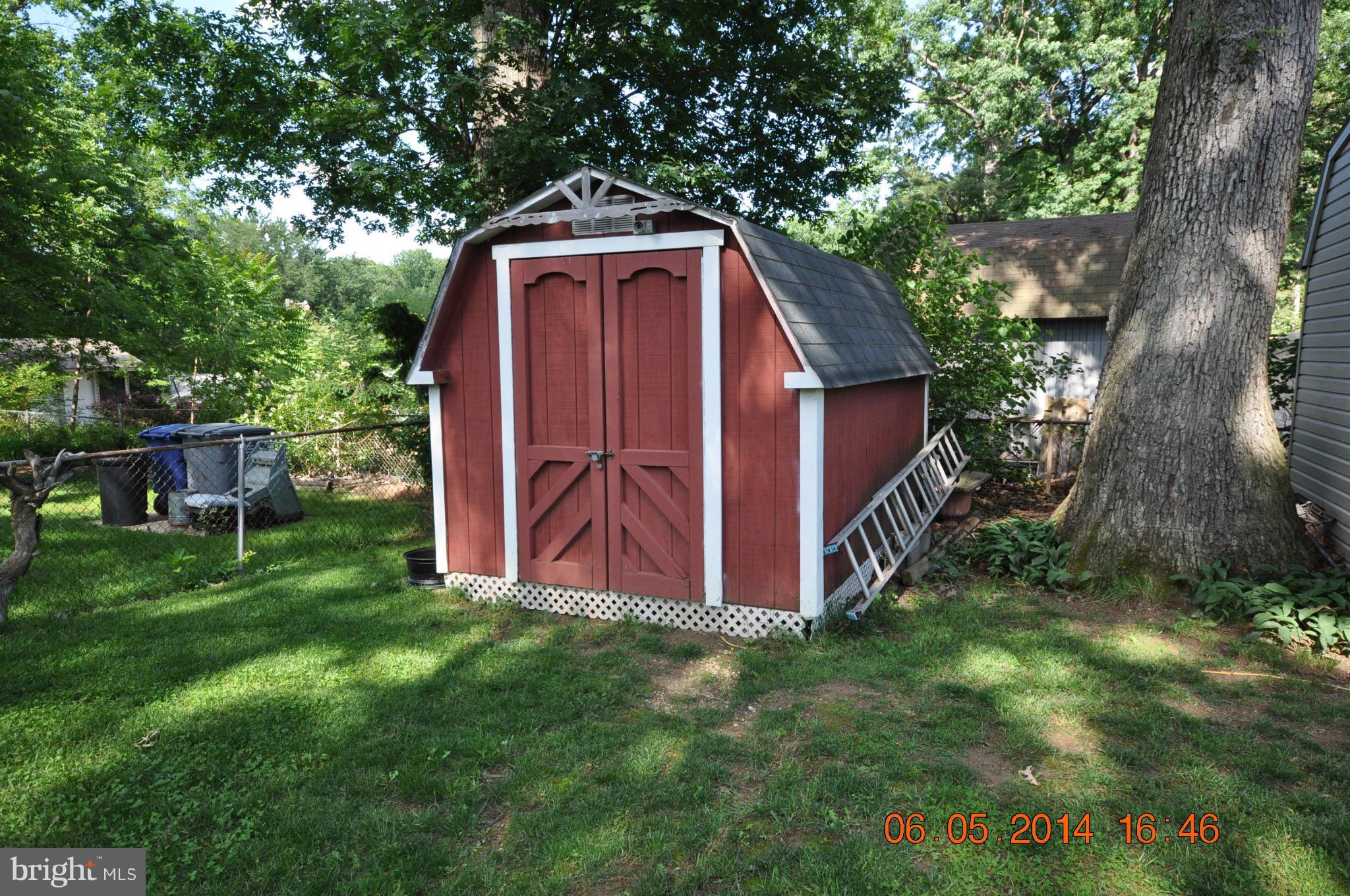 5905 Brookland Road Alexandria, VA 22310 - Photo 11 of 24 a front view of a house with garden