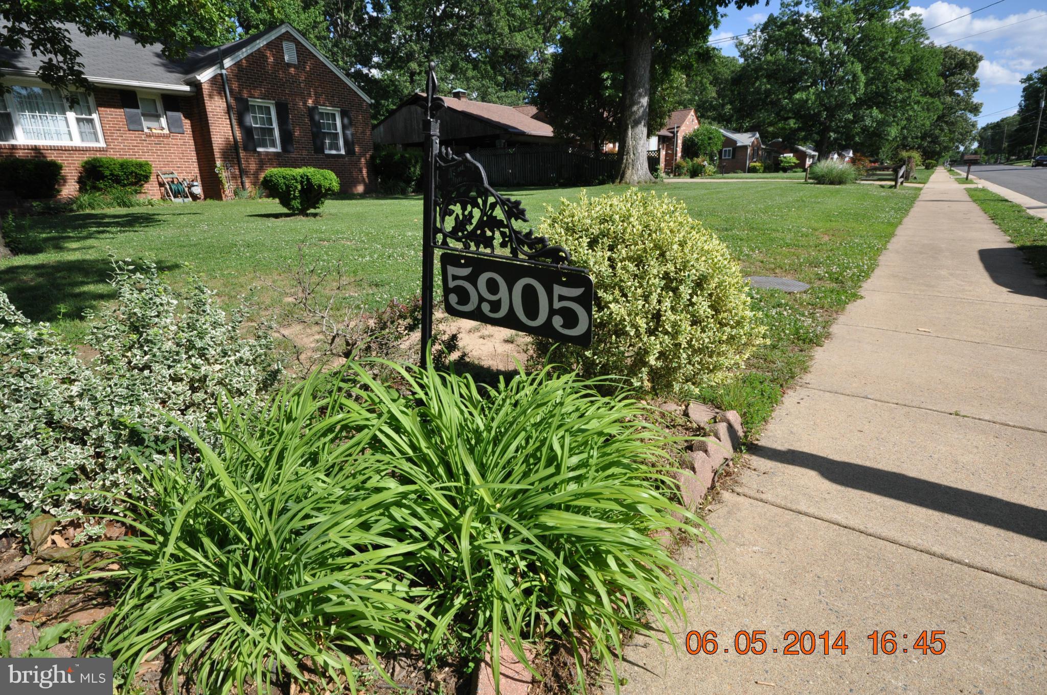 5905 Brookland Road Alexandria, VA 22310 - Photo 13 of 24 a view of a house with a yard