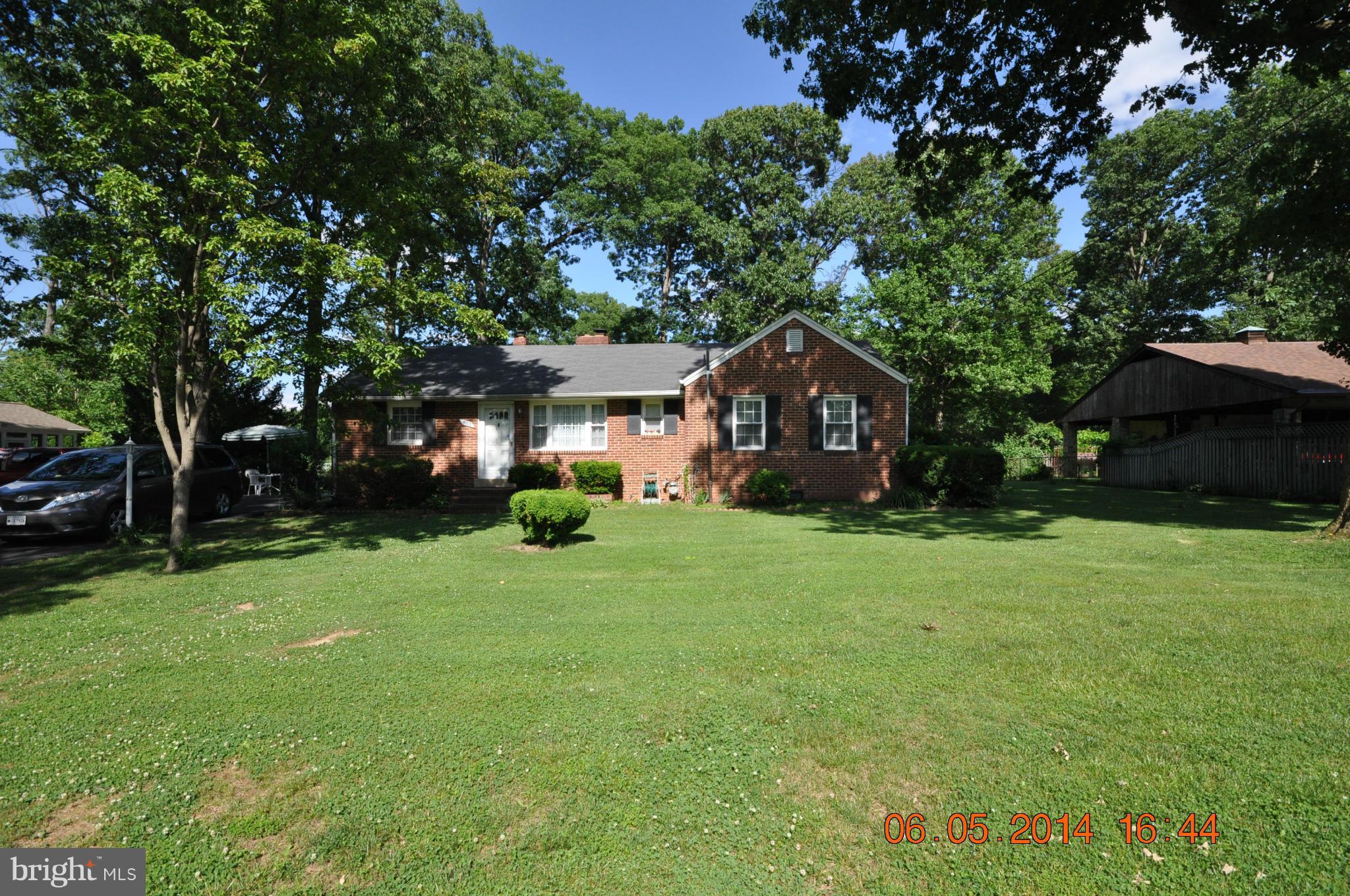 5905 Brookland Road Alexandria, VA 22310 - Photo 3 of 24 a front view of a house with garden