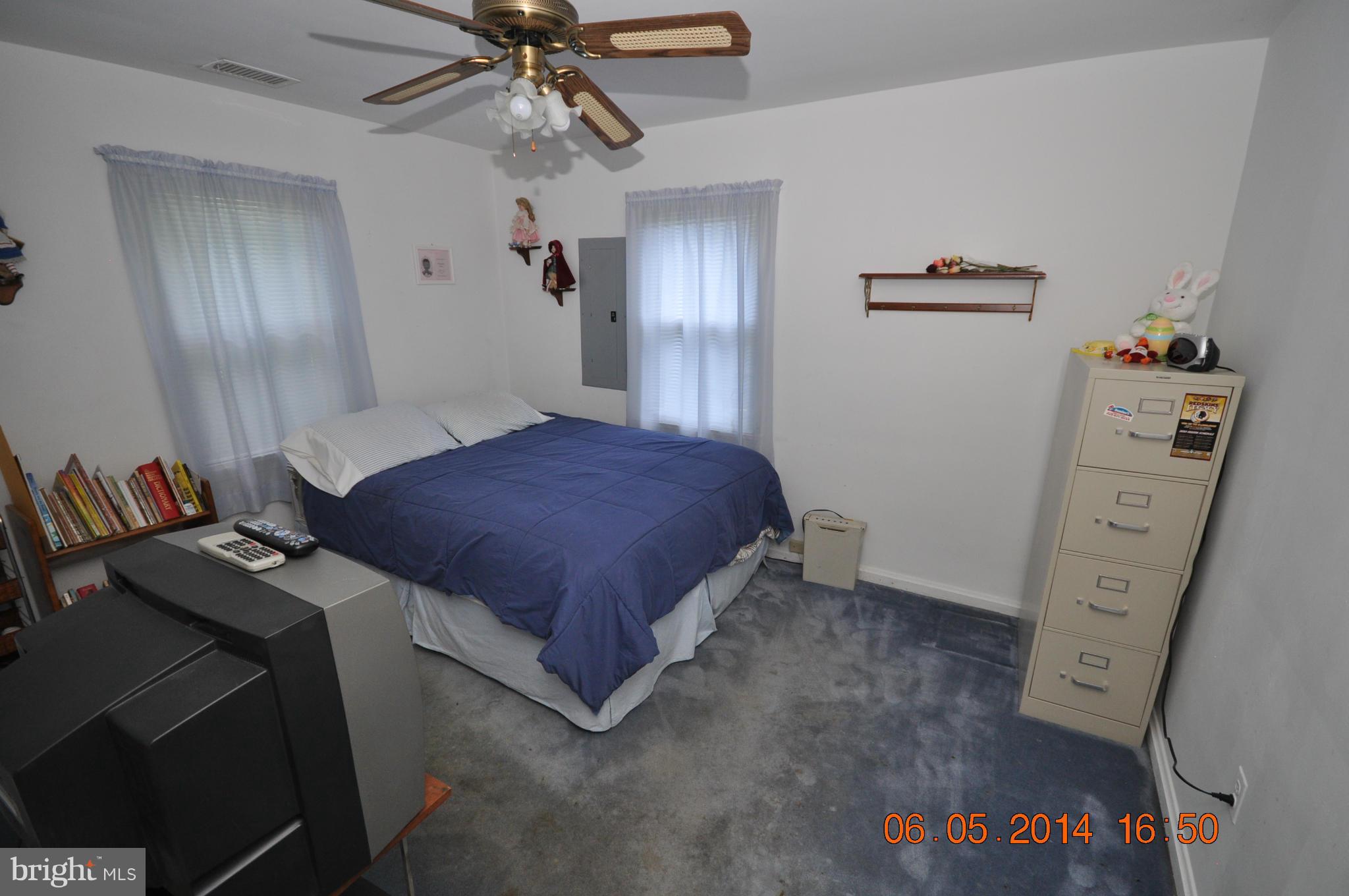 5905 Brookland Road Alexandria, VA 22310 - Photo 22 of 24 a bedroom with a bed and a dresser