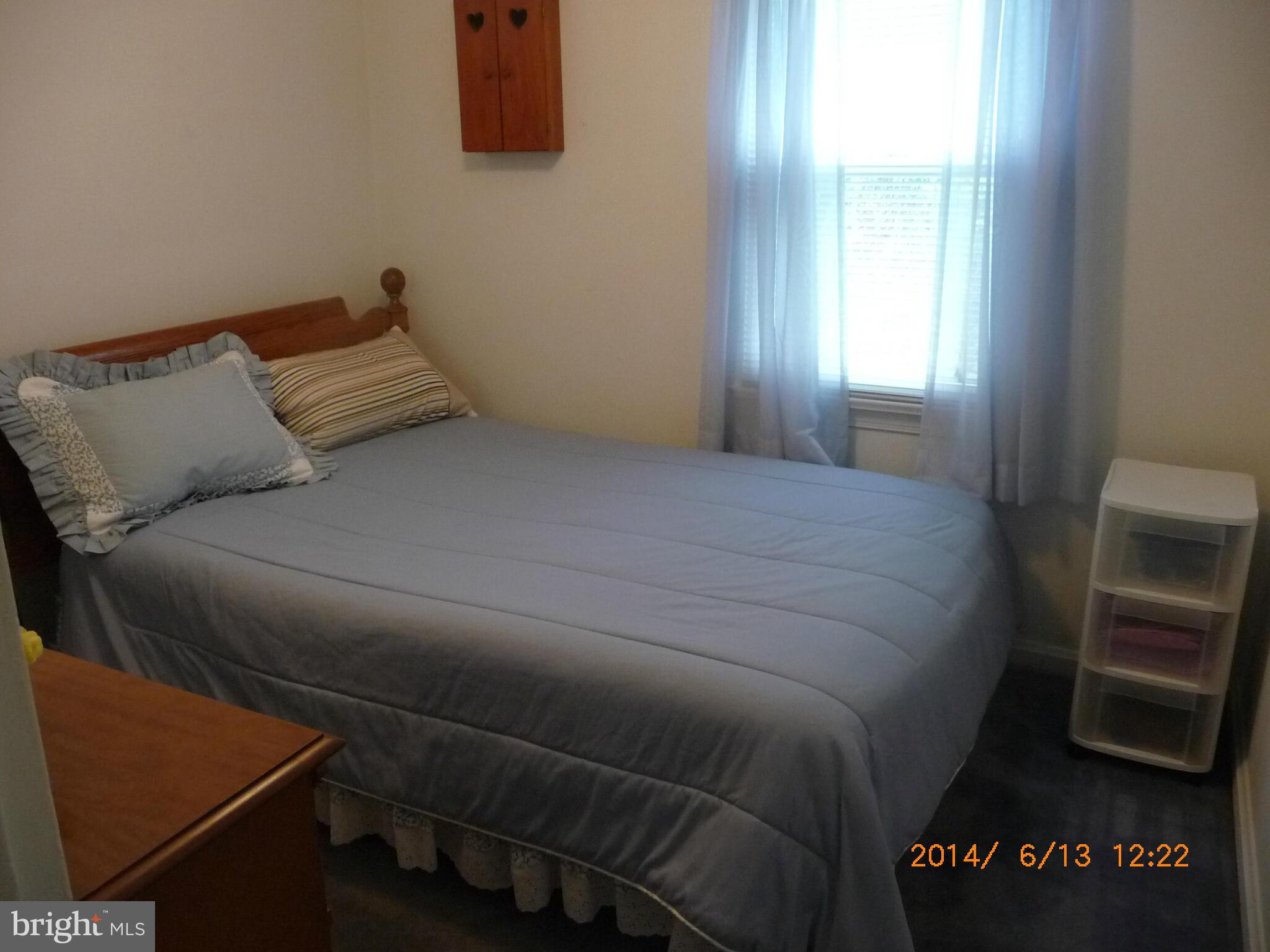 5905 Brookland Road Alexandria, VA 22310 - Photo 23 of 24 a bed sitting in a bedroom next to a window