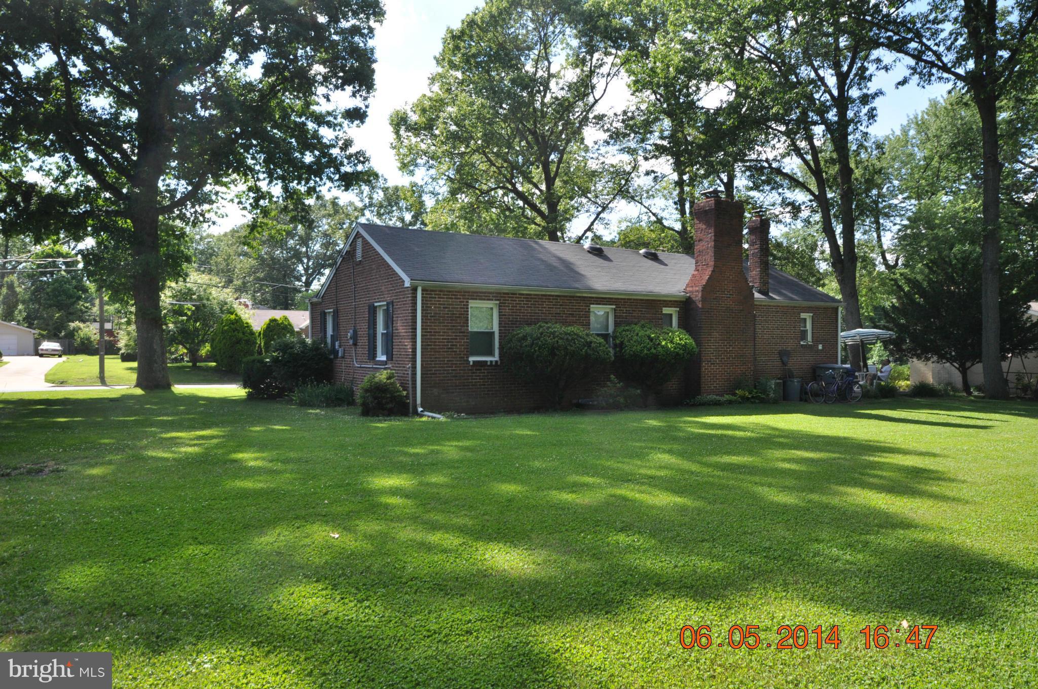5905 Brookland Road Alexandria, VA 22310 - Photo 6 of 24 a view of a house with a big yard plants and large trees