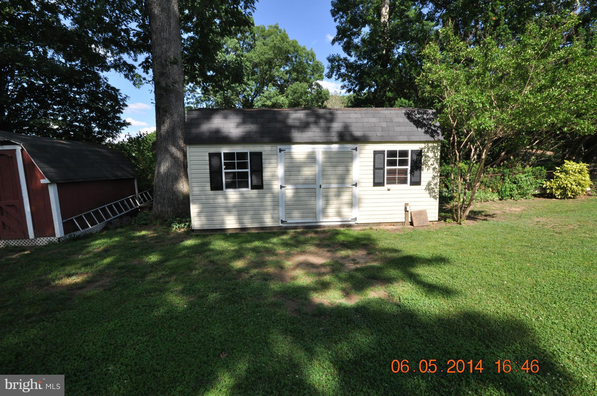 5905 Brookland Road Alexandria, VA 22310 - Photo 10 of 24 a front view of a house with a yard