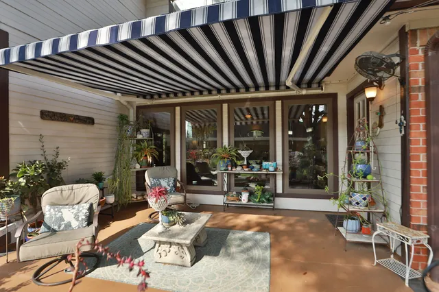 a view of a chairs and tables in patio