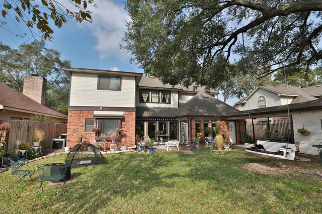 a view of a house with a yard porch and sitting area