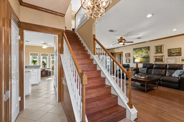 a view of entryway and hall with wooden floor
