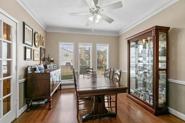 a view of a dining room with furniture window and wooden floor