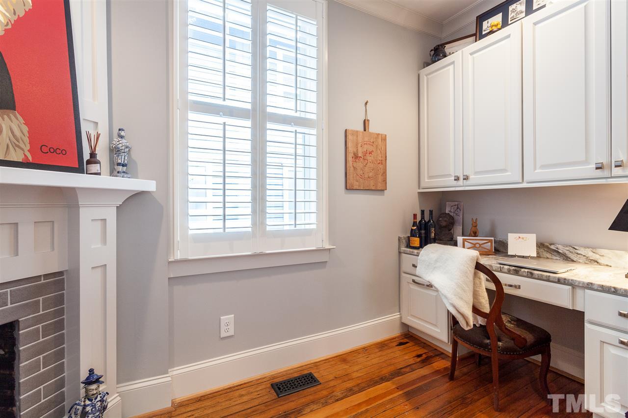 507 Adams Street Raleigh, NC 27605 - Photo 14 of 30 a workspace with furniture and window
