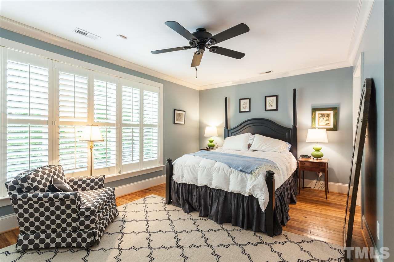 507 Adams Street Raleigh, NC 27605 - Photo 16 of 30 a bedroom with a bed and a window with outer view