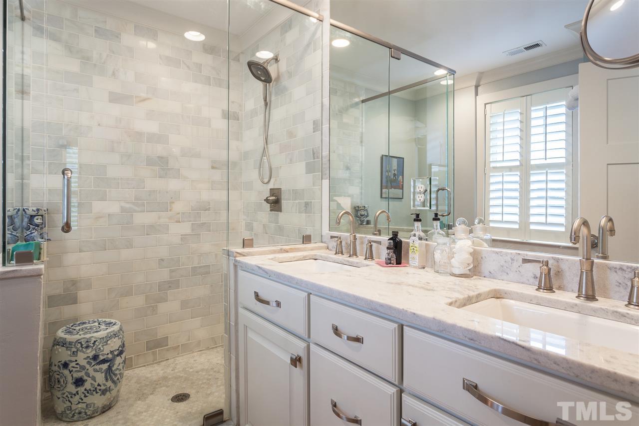 507 Adams Street Raleigh, NC 27605 - Photo 18 of 30 a bathroom with a granite countertop sink mirror and double