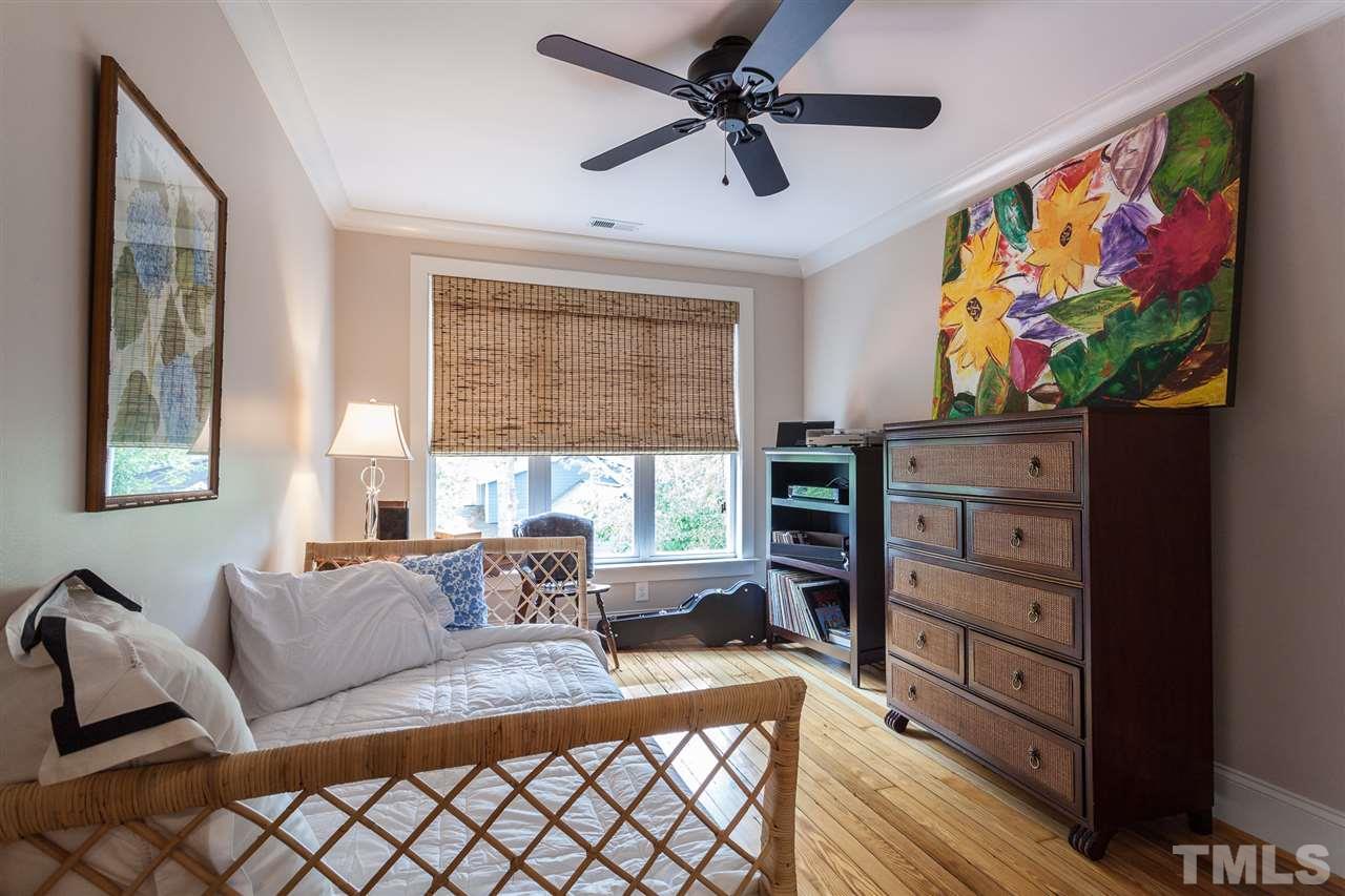 507 Adams Street Raleigh, NC 27605 - Photo 20 of 30 a living room with furniture and a flat screen tv
