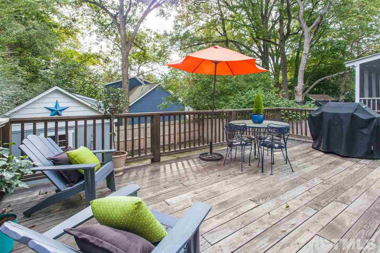 507 Adams Street Raleigh, NC 27605 - Photo 23 of 30 a view of a chair and tables in the patio