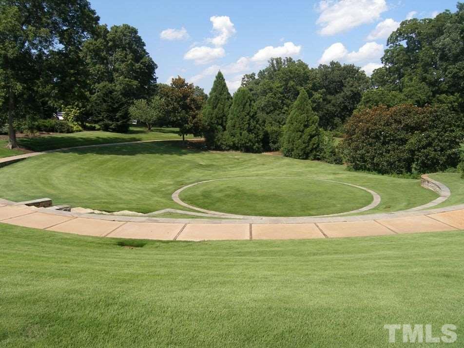 507 Adams Street Raleigh, NC 27605 - Photo 26 of 30 a view of a golf course with a lake