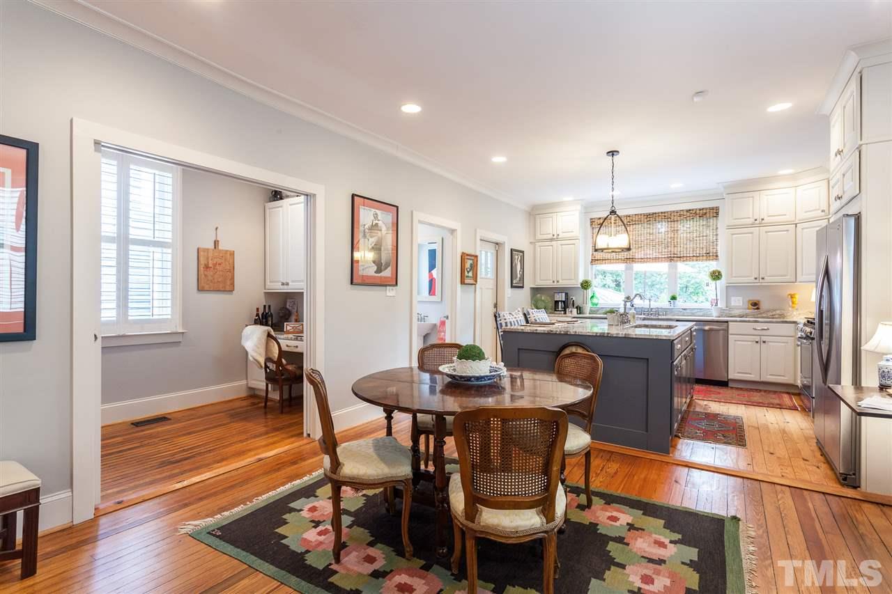 507 Adams Street Raleigh, NC 27605 - Photo 8 of 30 a dining room with furniture and wooden floor
