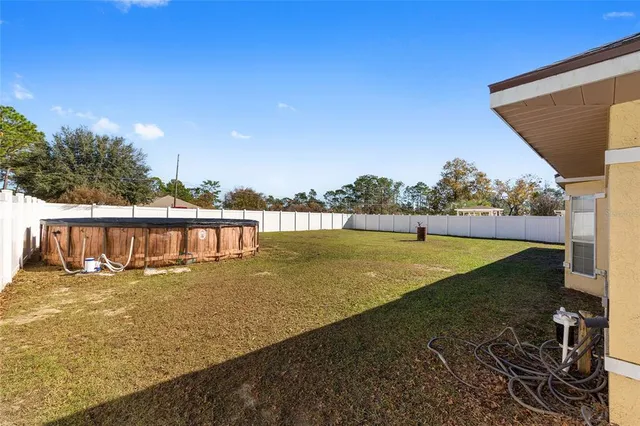 a view of a yard with a lake view
