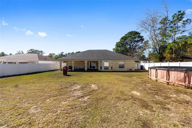 a front view of a house with a lake view