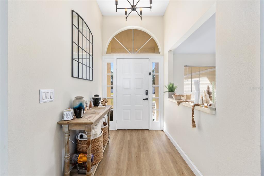 14 Bahia Trace Loop Ocala, FL 34472 - Photo 16 of 46 wooden floor in a en suite bathroom with a sink and mirror