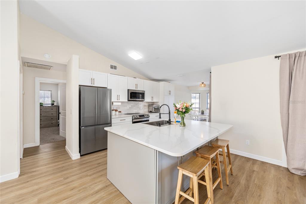 14 Bahia Trace Loop Ocala, FL 34472 - Photo 22 of 46 a kitchen with stainless steel appliances a refrigerator sink and microwave