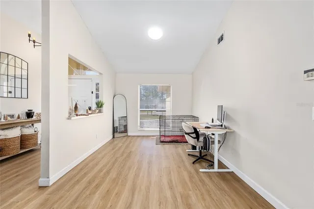 a workspace with furniture hardwood and a window