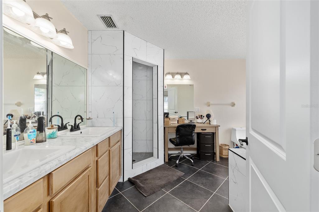 14 Bahia Trace Loop Ocala, FL 34472 - Photo 32 of 46 a bathroom with a sink and a mirror