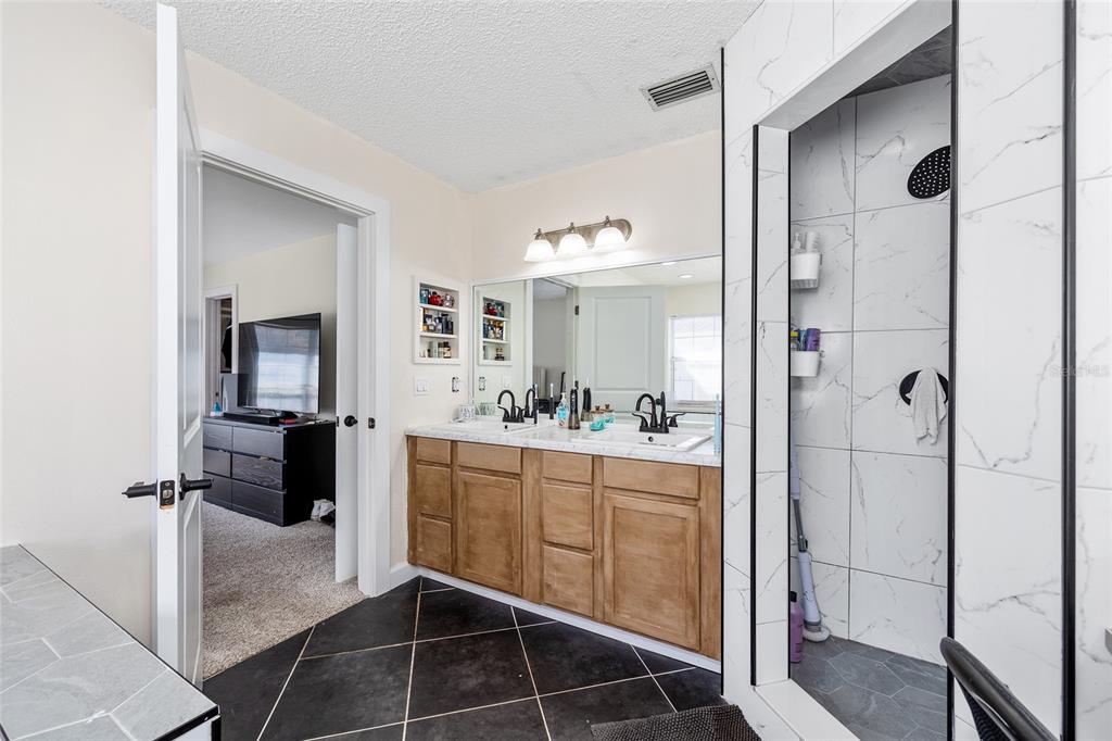 14 Bahia Trace Loop Ocala, FL 34472 - Photo 33 of 46 a bathroom with a double vanity sink and mirror