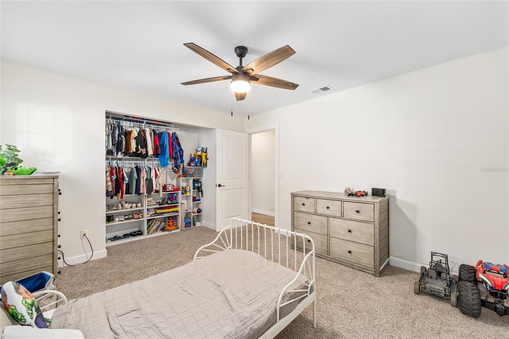 14 Bahia Trace Loop Ocala, FL 34472 - Photo 37 of 46 a bedroom with furniture and a ceiling fan