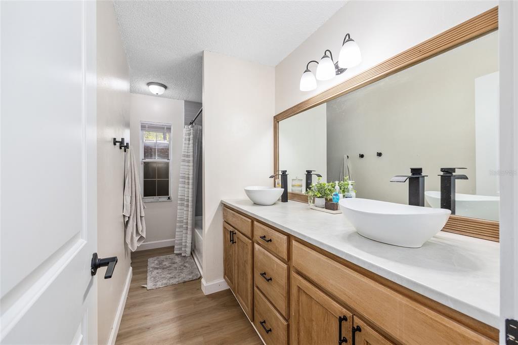 14 Bahia Trace Loop Ocala, FL 34472 - Photo 38 of 46 a spacious bathroom with a double vanity sink a mirror and a shower