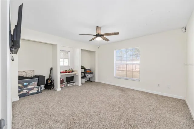 a view of a livingroom with furniture and a flat screen tv
