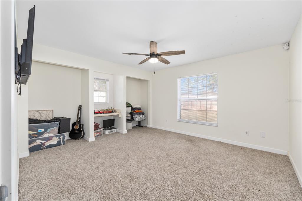 14 Bahia Trace Loop Ocala, FL 34472 - Photo 40 of 46 a view of a livingroom with furniture and a flat screen tv