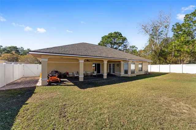 a view of a house with patio and garden