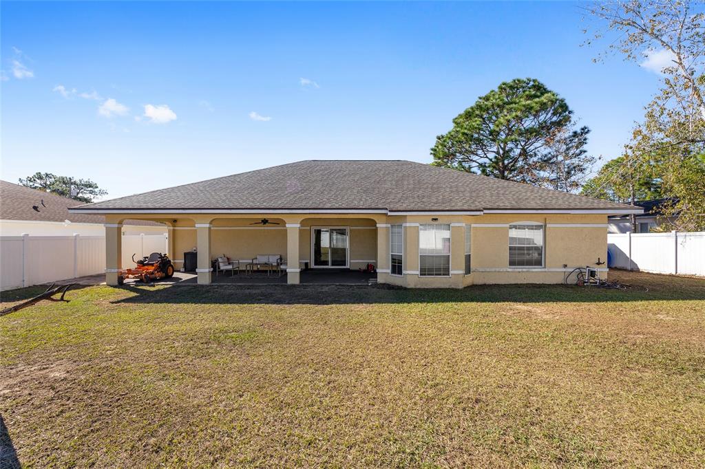14 Bahia Trace Loop Ocala, FL 34472 - Photo 9 of 46 a view of a house with swimming pool and a yard