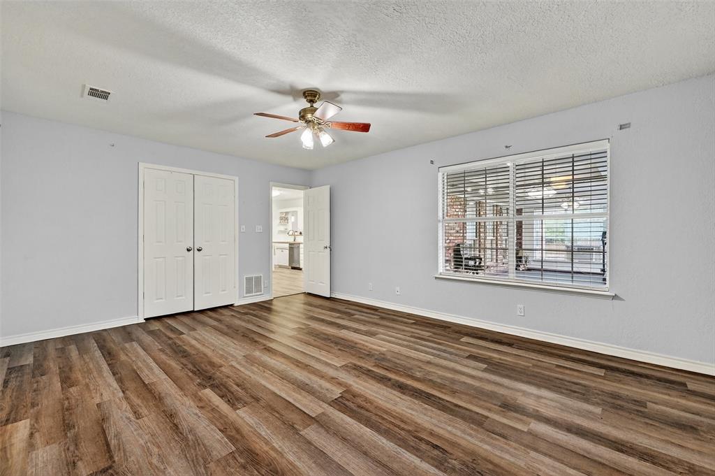 2107 Meadows Circle Sherman, TX 75092 - Photo 17 of 36 a view of empty room with wooden floor and fan