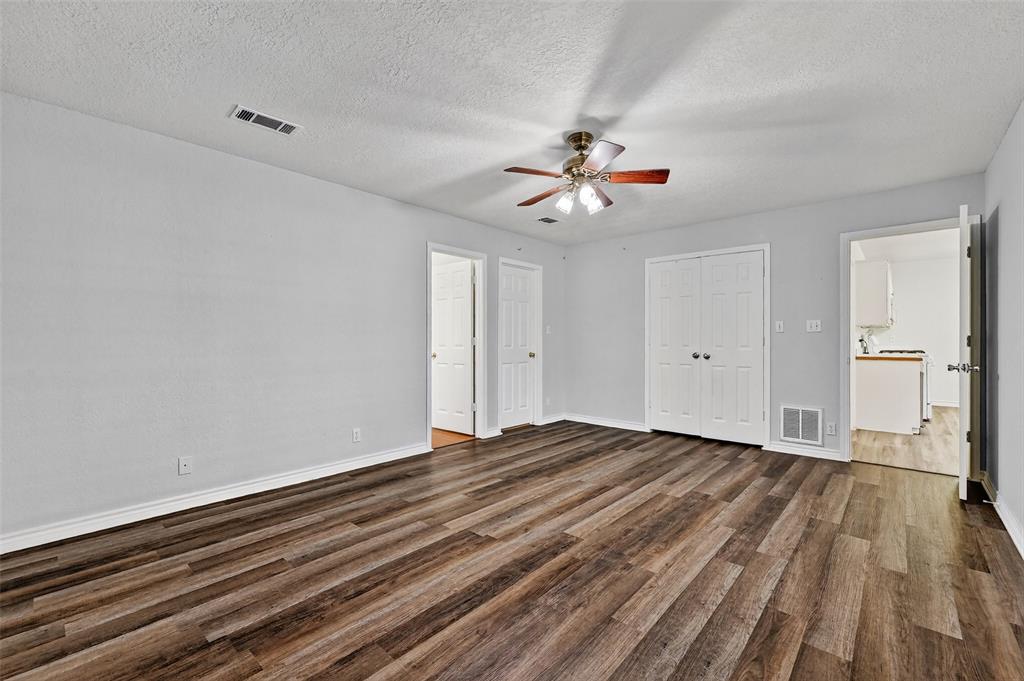 2107 Meadows Circle Sherman, TX 75092 - Photo 18 of 36 a view of empty room with wooden floor and fan