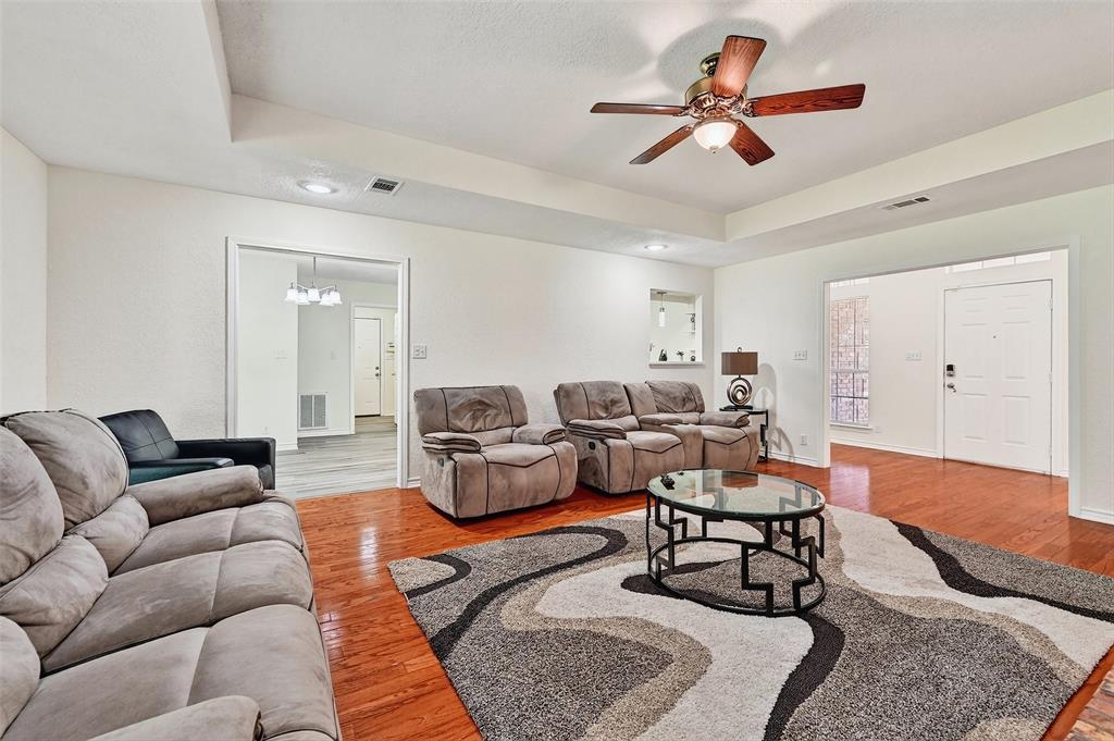 2107 Meadows Circle Sherman, TX 75092 - Photo 2 of 36 a living room with furniture